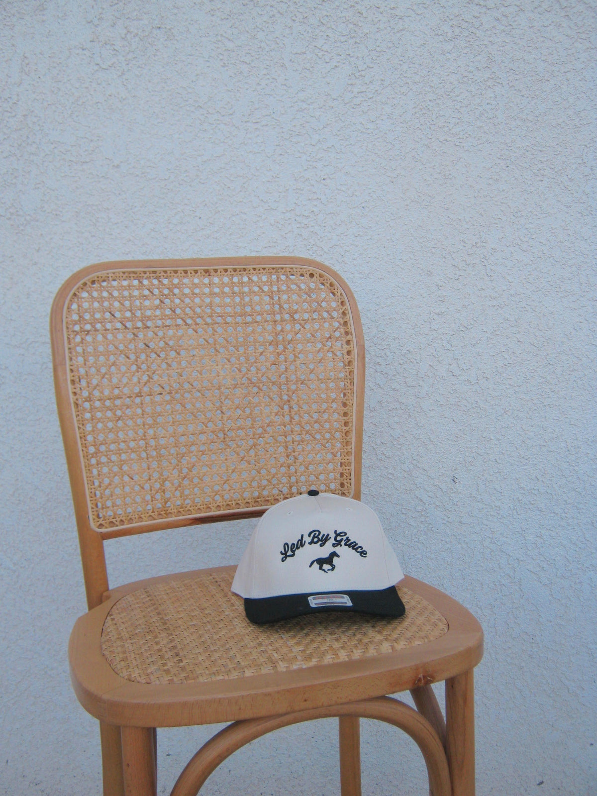 led by grace trucker - black